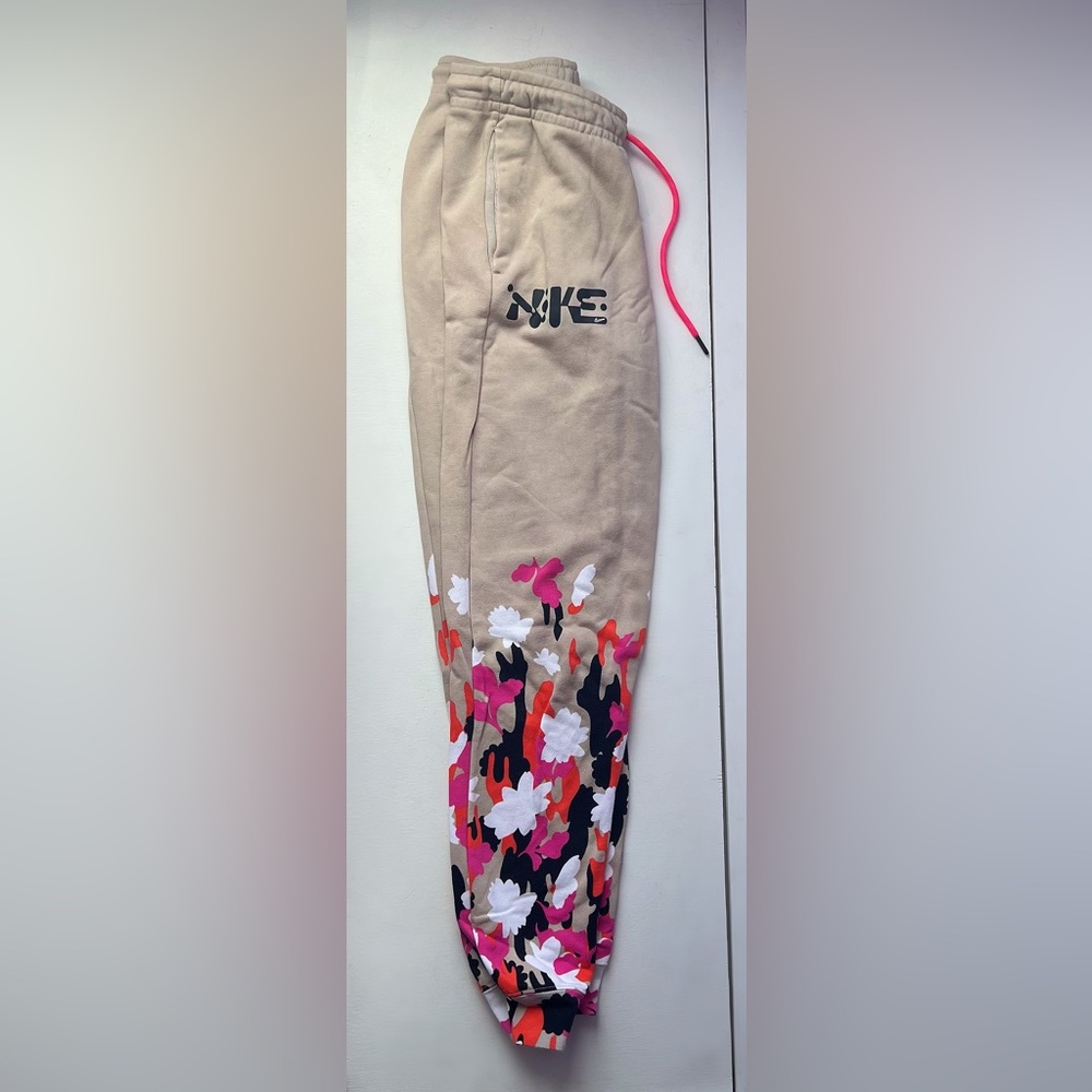 Tan Womens nike sweatpants with floral design